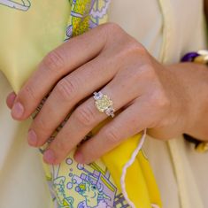 a close up of a person wearing a ring