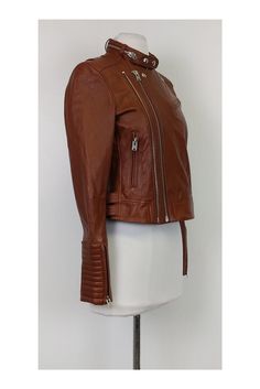 Polished yet edgy moto jacket in a rich tan color. The perfect layering piece for those chillier days. Silver-tone hardware adds a luxe touch. Size 4 100% lamb leather Silver-tone hardware Long sleeve Front pockets Lined Buckles on sides Bust 35" Waist 31.5" Shoulder to hem 19.5" Chic Brown Leather Biker Jacket, Luxury Brown Biker Jacket With Zipper Closure, Luxury Brown Biker Jacket With Zipper, Brown Asymmetrical Zip Outerwear For Spring, Brown Leather Jacket With Zipper For Fall, Fitted Brown Leather Jacket With Asymmetrical Zip, Chic Brown Biker Jacket For Fall, Luxury Biker Jacket With Asymmetrical Zip For Fall, Luxury Asymmetrical Zip Biker Jacket For Fall