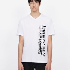 An Oversized Logo Shows You Are Part Of A Winning Team That Of Armani Exchange. This Men’s Stretch, Cotton Jersey T-Shirt Says It Loud And Clear: You Never Leave A Winning Team. - V-Neck T-Shirt - Contrasting Logo - Slim Fit - Fabric: 100% Cotton - Imported - Machine Wash - 6kztfb-Zjh4z V-neck T-shirt For Spring Streetwear, V-neck Logo Print Top For Streetwear, V-neck Top With Logo Print For Streetwear, White V-neck Graphic Tee, Streetwear V-neck Top With Logo Print, White Graphic Print V-neck Top, White V-neck Top With Text Print, White V-neck T-shirt With Letter Print, White Cotton V-neck T-shirt