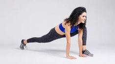 a woman is doing push ups on her stomach