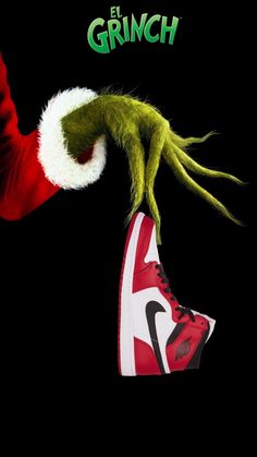 the grinch movie poster with his foot on top of a shoe