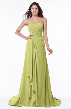 a woman in a strapless green dress