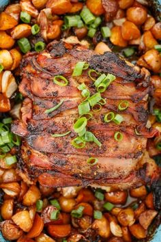 the meat is cooked and ready to be eaten in the dish with green onions on top