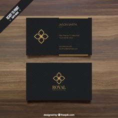 a black and gold business card with an elegant design on the front, side and back