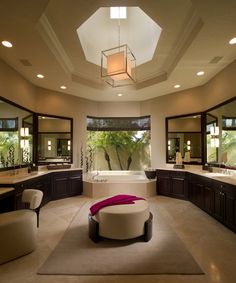 a large bathroom with two sinks and a tub