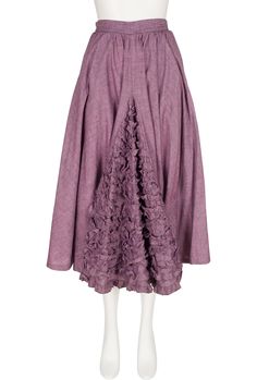 We have dated this Chantal Thomass high-waisted midi skirt to her 1983 S/S collection, as the same fabric was used on that season's runway. It was made in France of unlined mauve hand-woven cotton, with a ruffle inset in the front and a pocket on each side. A zipper fastens the back. We believe that the skirt has been taken in at the waist (please note the small waist size), but otherwise it's in very good condition, clean and ready to wear. Measurements: Waist - 22.75" Hips - open Length - 32" IMPORTANT NOTE FOR CANADIAN SHOPPERS: There is a 15% shipping fee that is automatically applied to Canadian orders, as legally we need to charge and remit sales tax domestically. We will promptly refund any overcharge, and apologize for any inconvenience. Purple Gathered Skirt Bottoms, Purple Relaxed Pleated Maxi Skirt, Purple Cotton Lined Skirt, Bohemian Purple Ruffled Skirt, Vintage Purple Lined Skirt, Flared Midi Skirt, Chantal Thomass, Hip Openers, Midi Flare Skirt