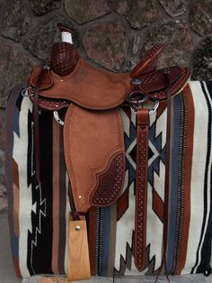 a saddle bag sitting on top of a rug