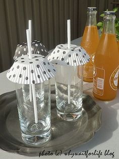 an image of drinks in glasses on a tray with the caption, use cupcake cases to cover drinks glasses in the summer and prevent flies from dropping in