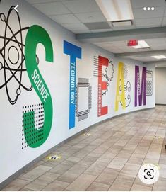 the hallway is decorated with colorful wall decals for science and technology students to learn