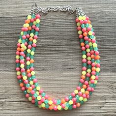 💞One of a kind & ready to ship💞  Dress up any outfit - great for a night out or with a white tee! 16 Inch Necklace with a 4 inch silver extender chain and silver lobster clasp. This is an eclectic necklace made from orange, yellow, green, and pink acrylic beads. A total conversion starter!  Thank you for supporting American small business! *Smoke and pet free home!* I ship 6 days a week! This particular necklace one of a kind and is READY TO SHIP!  Thank you for browsing my store! Multicolor Beaded Chain Necklace For Spring, Summer Party Beaded Necklaces With Large Beads, Spring Yellow Necklaces With Colorful Beads, Summer Party Large Beaded Necklaces, Spring Party Multicolor Beaded Necklaces, Spring Multicolor Beaded Necklace For Party, Bold Multicolor Summer Jewelry, Fun Multicolor Beaded Necklaces For Parties, Multicolor Fun Beaded Necklaces For Party