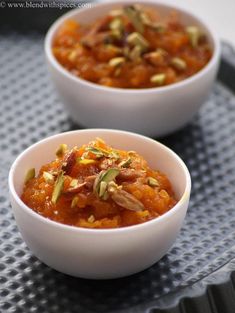 two white bowls filled with carrot coconut milk halwa