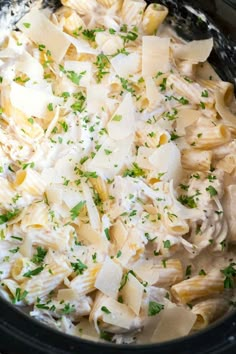 pasta with parmesan cheese and herbs in a slow cooker