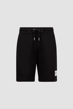 Crafted from cotton fleece, these shorts are designed for day-long comfort. Finished with an adjustable waistband and a discrete logo on the hem, they can be effortlessly paired with the matching hoodie. Casual Summer Shorts With Logo Waistband, Black Casual Shorts With Logo Waistband, Casual Shorts With Logo Waistband, Athleisure Shorts With Logo Waistband, Cotton Bottoms With Logo Detail And Relaxed Fit, Cotton Bottoms With Logo Waistband For Loungewear, Relaxed Fit Cotton Bottoms With Logo Waistband, Cotton Bottoms With Logo Waistband And Relaxed Fit, Modern Cotton Shorts