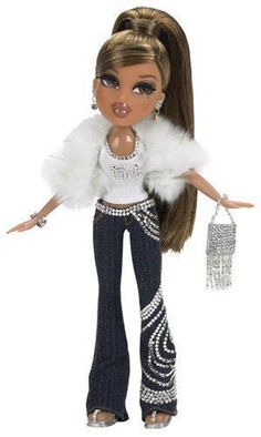 a barbie doll with long hair and white fur stole on her shoulders, holding a purse