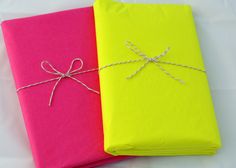 two bright colored sheets tied together with twine