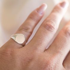 .925 Sterling Silver Round Signet Ring. 9mm x 11mm Perfect for him or for her. Wear on any finger! I like to wear mine on my pinky. Happy to offer custom engraving options. Up to three letters. Please note engraving in the comments at check out. Please see photos for different font options. *For engraving please allow an additional 1 - 3 days for processing* Made in California. Worn everywhere. Silver Tarnish-resistant Round Band Signet Ring, Silver Tarnish-resistant Signet Ring, White Sterling Silver Signet Ring Minimalist Style, Minimalist White Sterling Silver Signet Ring, Silver Engraved Ring Tarnish Resistant, Silver Engraved Ring Tarnish Resistant Round Band, Silver Engraved Tarnish-resistant Ring, Silver Engraved Ring With Tarnish Resistant Round Band, Classic Hypoallergenic White Gold Rings