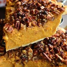 two slices of pumpkin pecan pie stacked on top of each other