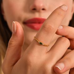 Introducing our stunning 14K Gold Minimalist Emerald Ring, a true embodiment of elegance and charm. This dainty diamond ring boasts a stackable design, making it perfect for mix and match with other gold rings in your collection. The mesmerizing green gemstone, carefully handcrafted and set in 14K gold, adds a touch of vibrancy to any outfit. Not only is this exquisite piece a gorgeous accessory, but it also holds sentimental value as the May birthstone gold ring, making it an ideal birthday gif Dainty Birthstone Ring With Single Diamond For Gift, Open Ring For May Birthstone, Elegant Rings With May Birthstone Gemstone, Elegant Gemstone Rings For May Birthstone, Elegant Diamond Ring For Anniversary, May Birthstone, Anniversary Sapphire Ring With Bezel Setting For May Birthstone, Elegant White Gold Crystal Ring For May Birthstone, Fine Jewelry Rings With Single Diamond For Gift, Fine Jewelry Stackable Solitaire Rings For May Birthstone