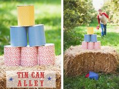 an outdoor birthday party with tin cans stacked on top of hay bales, and a little boy playing in the background