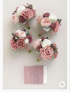 wedding bouquets with pink and white flowers are arranged next to a piece of paper