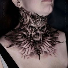 a woman with tattoos on her neck and chest