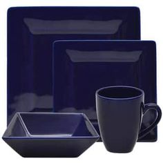 a set of blue dinnerware with cups and saucers