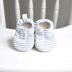 "Our booties are constructed from soft, flexible and breathable material which allows baby to move and wiggle their feet without feeling restricted. They feature an inner Sherpa lining, making them cozy against baby's skin. A comfortable enclosed elastic heel our baby booties stay on wiggly feet!  Baby booties features : Main: 100% Cotton  Vegan Suede Sole : 100% polyester Non-slip vegan suede sole make them the perfect shoe for little ones crawling, cruising or learning to walk Sizing : To ensure proper fit, please measure your child's foot from heel to big toe and add 1/2 an inch for wiggle room. Monthly sizes are only an estimate. There are 4 sizes available which range from newborn thru 12 months. 0-3 months measures 4.0\" from toe to heel 3-6 months measures 4.5\" from toe to heel 6-9 Comfortable Soft Booties For Playtime, Comfortable Round Toe Booties For Playtime, Comfortable Soft White Booties, Comfortable White Closed Toe Booties, White Non-slip Slippers For Playtime, Spring Booties With Soft Sole For Playtime, Comfortable Non-slip White Booties, White Soft Sole Booties For Playtime, Blue Non-slip Booties For Playtime