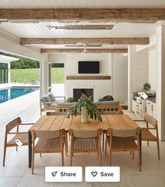 a dining room table with chairs and a television mounted to the wall next to an outdoor swimming pool