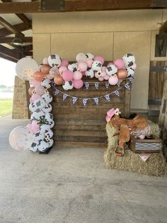 a decorated horse stable with balloons and decorations