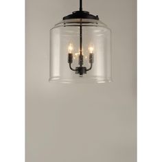 a glass light fixture with three lights hanging from it's side and the ceiling