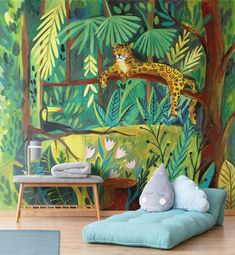 a wall mural with a leopard on a tree branch in front of a jungle scene