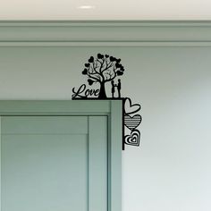 the love tree wall decal is shown in black