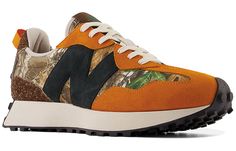 If you're looking for a sneaker that can take you from the city to the great outdoors, then you need the Realtree x atmos x New Balance 327 'Camo' in your life. This progressive lifestyle runner features a hunting and outdoor theme, highlighted by a Realtree EDGE camouflage pattern throughout the canvas upper. Contrasting orange accents add a pop of color, while the hairy brown suede heel overlay and black 'N' logo give this sneaker a stylish edge. The EVA midsole provides lightweight cushioning New Balance Urban Sneakers For Outdoor, New Balance Urban Outdoor Sneakers, Urban New Balance Sneakers For Outdoor, The 355, Real Tree Camo, Black Color Combination, Brown Suede Heels, New Balance 327, Orange Accents