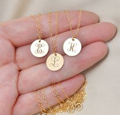 "This 14k gold filled necklace will be custom engraved with your choice of upper case initial in a beautiful ornate font and attached on a shimmering 14k gold filled chain. Please select initial and length from the drop down menus. The length does not include the pendant. Components: Disc - 14k gold filled, 13x11mm (1/2\" wide). Chain - 14k gold filled *14k gold filled components are considered hypoallergenic, they will never tarnish or rust and are water safe too! Your item will arrive in a bea Gold Jewelry With Name For Bridesmaid Gift, Gold Initial Pendant Necklace For Best Friend, Elegant Initial Pendant Jewelry For Best Friend, Personalized 14k Gold Filled Initial Necklace, Personalized Gold Jewelry For Bridesmaid, Elegant Initial Pendant Charm Necklace For Best Friend, Elegant Engraved Charm Necklace For Best Friend, Personalized Gold Initial Necklace For Best Friend, Initial Necklace With Pendant For Best Friend Gift