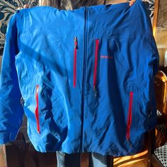 Incredible Jacket! Worn For One Season. Incredibly Warm With Optimal Storage And Breathability. A Few Small Stains As Pictured, Easily Removable With A Wash. Men’s Ski Jacket In Excellent Condition. 100% Nylon With 100% Polyester Lining And 85% Goose Down Insulation. Durable Waterproof, Wind Proof And Breathable. Zippered Compartments Under The Arms, Inside The Body Of The Jacket By Stomach Holds A Mesh Pouch. Two Way Adjustable Fixed Hood With A Laminated Visor. Patagonia Winter Windbreaker, Patagonia Long Sleeve Outerwear For Hiking, Waterproof Patagonia Outerwear, Patagonia Long Sleeve Windbreaker For Hiking, Blue Long Sleeve Outerwear For Skiing, Patagonia Ski Jacket, Blue Patagonia Winter Outerwear, Winter Blue Patagonia Outerwear, Functional Blue Outerwear For Snowboarding