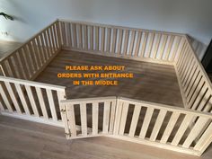 there is an empty room with wooden stairs and railings on the floor, which reads please ask about orders with entrance in the middle