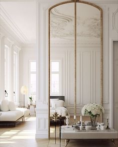 a living room filled with furniture and white walls