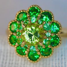 Yellow Mali Garnent Ring. With neon green tsavorite garnet. Set in 14K yellow Gold. A beautiful and unique neon yellow garnet ring, created in double halo hydrangea settings to create a luxurious and high-quality piece of jewelry, perfect to express your love. 💎 PREMIUM RING -- A brand new garnet ring, personally designed and made with the highest quality of 14K yellow gold. It is designed ✨ CLASSIC BRILLIANCE -- Designed with a beautiful neon yellow mali garnet at the center and neon green tsa Green Multi-stone Emerald Ring For May Birthstone, Green Emerald Cluster Ring With Multi-stones, Fine Jewelry Green Multi-stone Emerald Ring, Fine Jewelry In Green Peridot, Green Multi-stone Emerald Ring Fine Jewelry, Green Multi-stone Jewelry For May Birthstone, Green Gemstone Cluster Ring For May Birthstone, Green Fine Jewelry With Accent Stones, Green Peridot Fine Jewelry