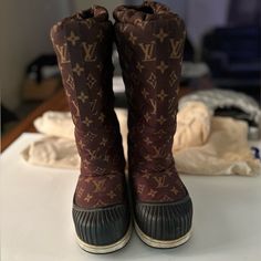 Colour: Brown/Black Condition: This Item Is In Good Pre-Loved Condition With Signs Of Wear On Bottoms And Some Wear Marks Guarantee Authentic. With Dust Bags Louis Vuitton Brown, Winter Rain, Snow Boots, Rain Boots, Black And Brown, Promotion, Dust Bag, Louis Vuitton, Monogram