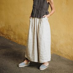 Welcome to Pavietra! These Dusty Lavender Palazzo Linen Pants feature a chic cropped wide-leg design and convenient pockets, combining fashion and functionality. Ideal for warm weather, these Summer Culottes for Women offer a comfortable fit and a stylish look for any casual occasion. DETAILS ⚬ Pleated front. ⚬ Adjustable elastic waistband in the back. ⚬ Zipper and button closure. ⚬ Side and back pockets. ⚬ High waist. ⚬ Made of washed organic Oeko-Tex certified linen. ⚬ The linen is NOT see-thr Casual Lavender High Waist Pants, Lavender Wide Leg Cotton Bottoms, High-waist Lavender Pants For Spring, Lavender Relaxed Fit Bottoms For Summer, Lavender Relaxed Fit Pants For Summer, Casual Lavender Wide Leg Bottoms, Casual Lavender Bottoms For Spring, Casual Lavender Wide Leg Pants, Lavender Casual Bottoms For Spring