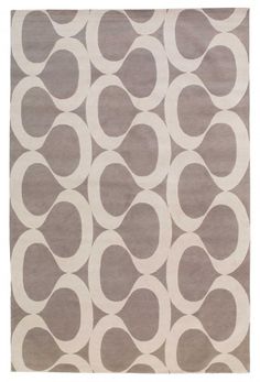 a gray and white rug with circles on it