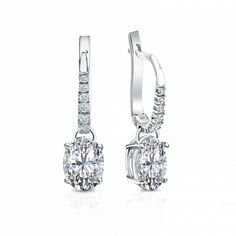 Dangle studs 4-prong basket set diamond earrings make an elegant statement for any occasion. These 14k white gold earrings can last a lifetime. The earrings feature oval-cut natural diamonds with 1.50 ct. total weight for center stone and with 0.10 ct. total weight of small dazzling round-cut diamonds as side stone totaling to 1.60 ct. in a complete pair, available in lever back clasps. Black Diamond Pendant, Black Diamond Studs, Halo Diamond Earrings, Solitaire Diamond Pendant, Colored Diamond Rings, Platinum Earrings, Black Diamond Ring, Earrings Dainty, White Gold Earrings