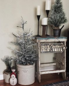 a small christmas tree sitting on top of a wooden table