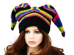 Have some winter fun and stand out with this Whimsical Court Fool Hat. I've crocheted this in neon goth colors, with a knitted ribbed band for easy stretch and fit. The stripes are blended with black for that extra pop. It gives a touch of fae, or impish sprite vibes and is just pure fun. Certain to add a unique character when you are out and about, skiing, snowboarding, going to an outdoor concert, a festival, hiking through the forest, or even a fun costume accessory! Makes a fun gift for him or her. Lots of stretch, so one size will fit most. Machine wash cold and toss it in the dryer. Goth Colors, Fae Costume, Neon Goth, Winter Court, Court Jester, Snow Fun, Easy Stretches, Outdoor Concert, Elf Hat