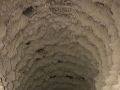 the inside of a tunnel that is filled with snow