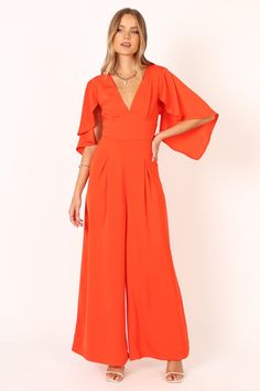 Carla Jumpsuit - Red - Petal & Pup USA Wedding Swimwear, Pink Jumpsuit, Affordable Dresses, Cape Sleeves, Red Jumpsuit, Clothing Details, One Piece Outfit, Wide Leg Pant, The Talk