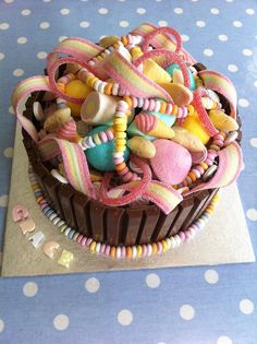 a chocolate cupcake decorated with candy and candies