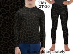 two kids wearing black and brown animal print pants with the same pattern as their bodysuits