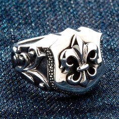 Fleur De Lis 925 Sterling Silver Biker Ring ~Brand New   hand-crafted from high-quality sterling silver;  925 hallmark sits inside the band;  Ring’s face size measures ¾” x ¾” (18 mm x 18 mm);  Weight:  14 grams;    We made this piece by hand.   Nothing speaks Gothic more than the fleur de lis motif. This Fleur de lis Sterling Silver Biker Ring will prove it to you that Gothic can be elegant and exquisite.  Fleur de lis, which means lily flower, is a heraldic symbol known since the Middle Ages. Biker Rallies, Biker Rings, Gothic Rings, The Middle Ages, Ring Ideas, Mode Design, Prove It, Lily Flower, Middle Ages