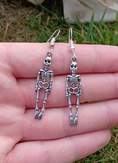 Silver plated earring hooks with skeleton charms 💀 Bone Colored Metal Earrings For Pierced Ears, Silver Skull Earrings With Ear Wire, Skull-shaped Metal Earrings With Ear Wire, Metal Skull Earrings With Ear Wire, Earrings Weird, Skeleton Earrings, Halloween Jewelry, Earring Hooks, Spooky Season